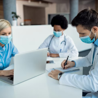 Medical professionals with laptop. Medical professionals with laptop.