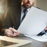 Man reviewing documents Man reviewing documents